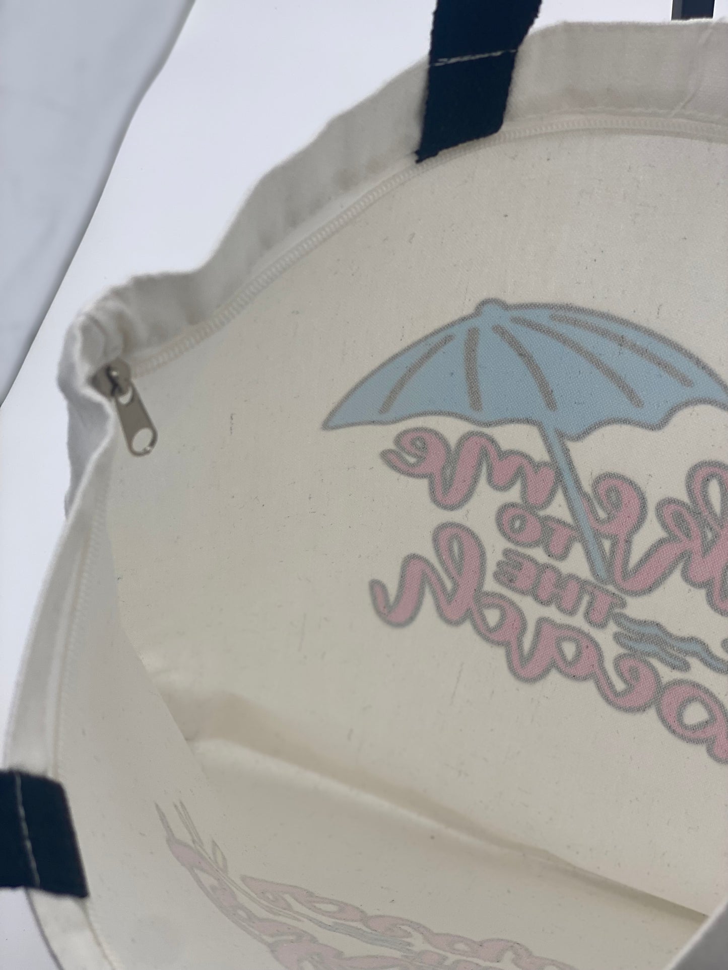 Inside view of canvas tote bag with take me to the beach design.