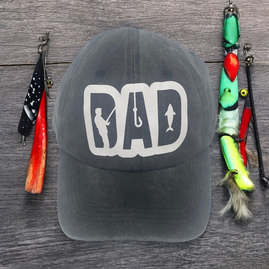 Black trucker dad hat with breathable cotton, perfect for fishing enthusiasts and outdoor adventurers. Casual lifestyle shot showcasing HTV fishing-themed design, lightweight and comfortable for everyday wear.