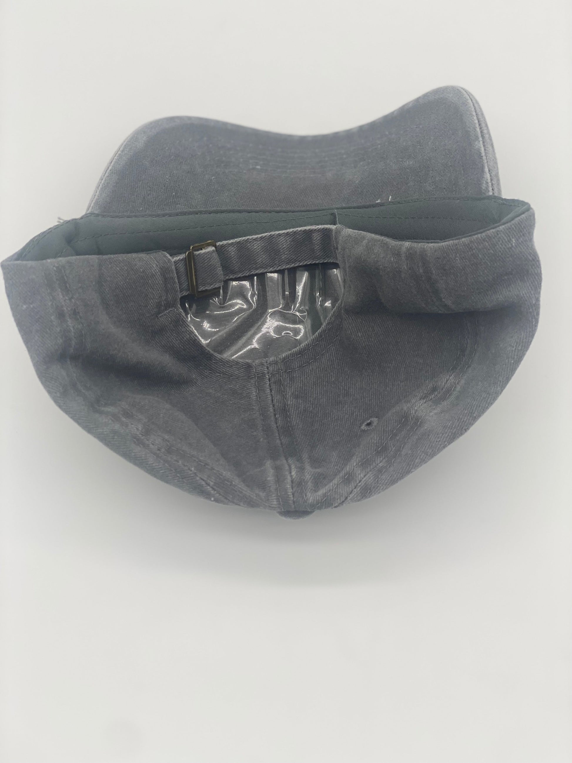 Gray trucker dad hat with breathable cotton, perfect for fishing enthusiasts and outdoor adventurers. Casual back shot showcasing HTV fishing-themed design, lightweight and comfortable for everyday wear.