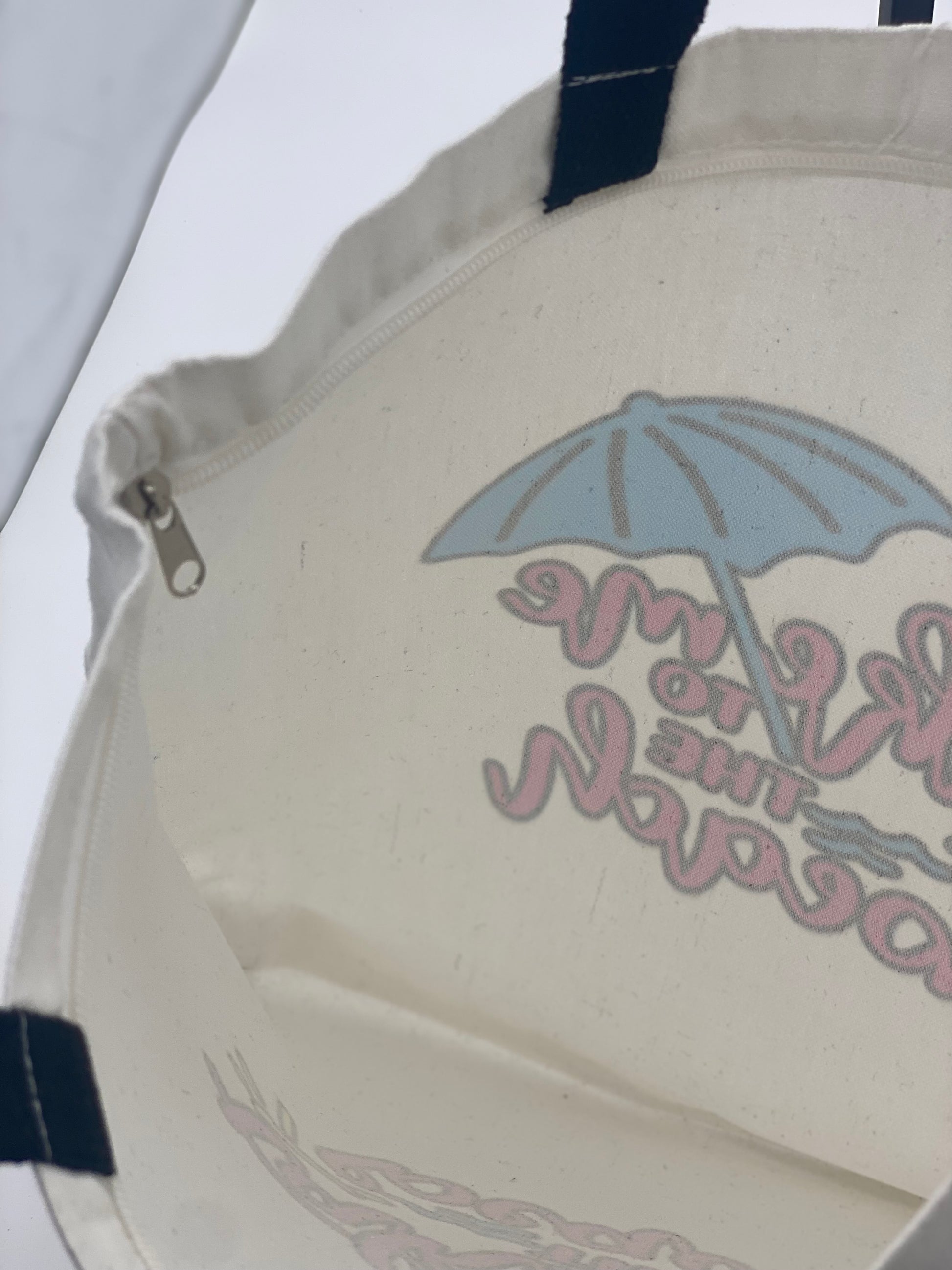 Inside view of canvas tote bag with take me to the beach design.