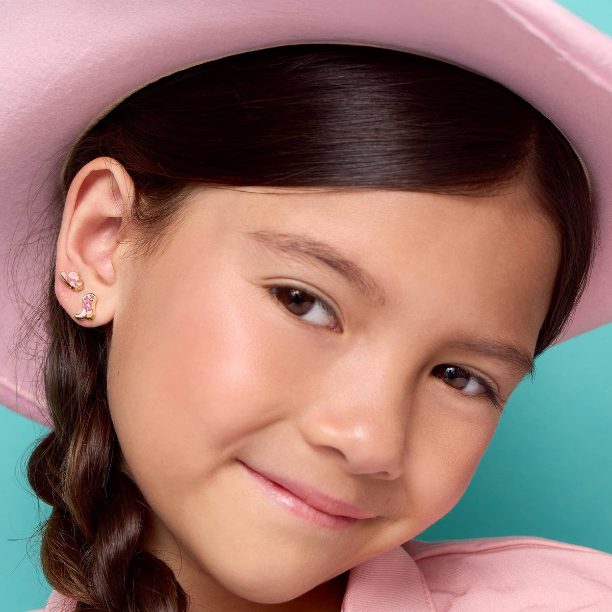 Seaside Custom Apparel & Gifts girl wearing pink cowgirl hat and hand-painted enamel cowgirl boot and hat earrings