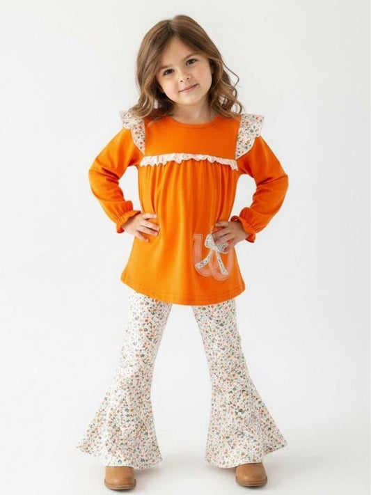 Seaside Custom Apparel & Gifts girls two-piece fall outfit with orange tunic, floral flare pants, and lace accents.