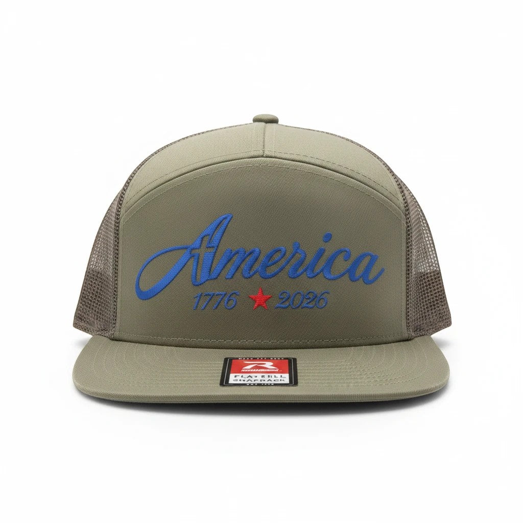Seaside Custom Apparel & Gifts olive green trucker hat with America 1776-2026 embroidery and breathable mesh back.