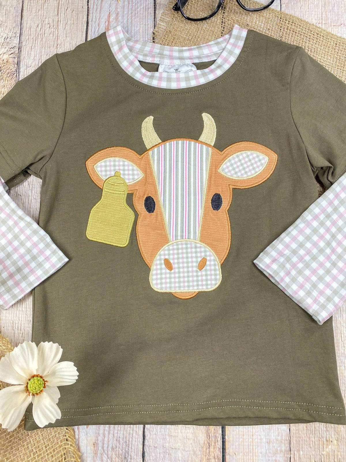 Seaside Custom Apparel & Gifts olive green boys long sleeve shirt with a cattle applique and gingham sleeve details.