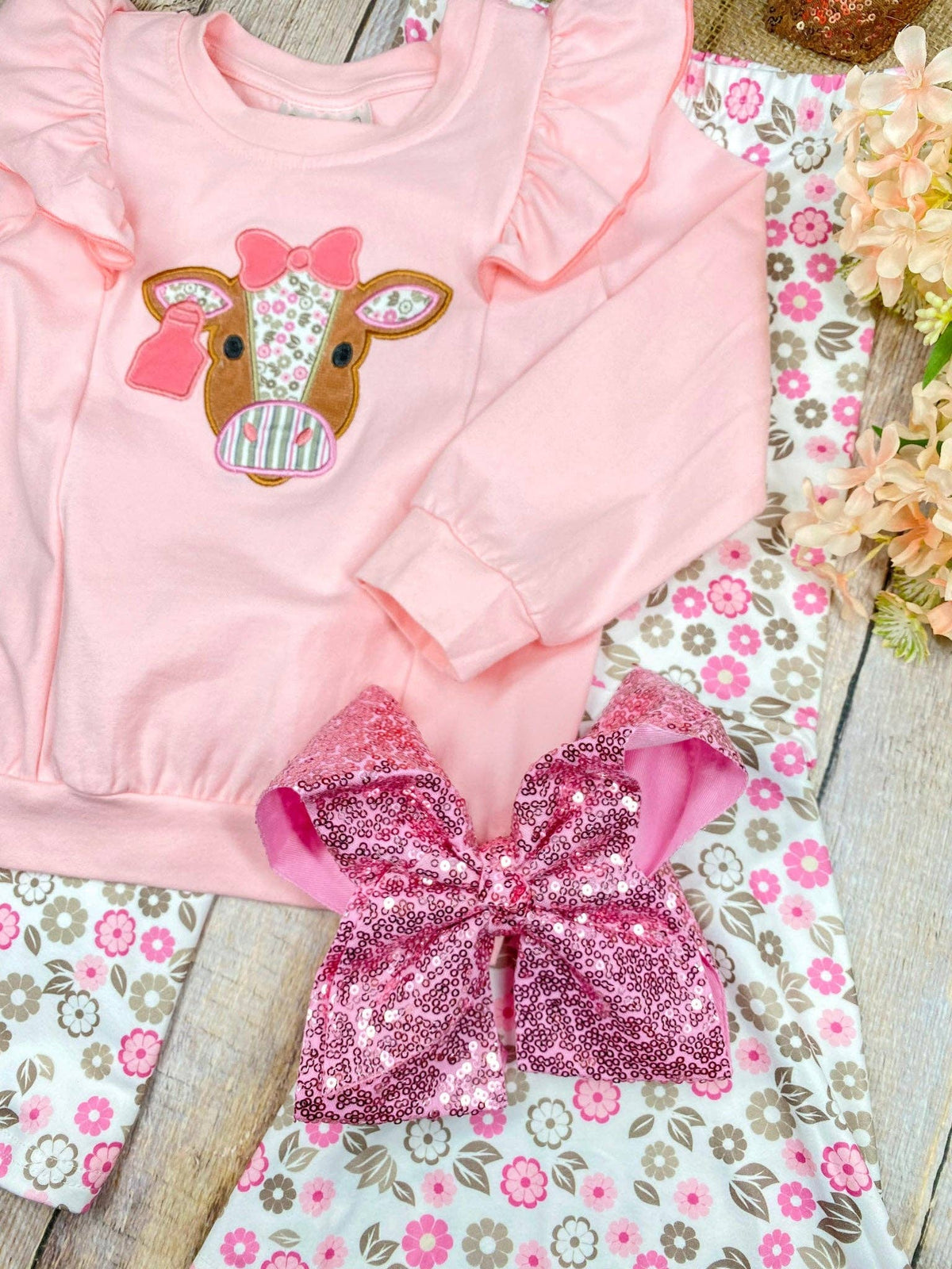 Seaside Custom Apparel & Gifts pink long sleeve top with cow applique and floral bell bottom pants two-piece set