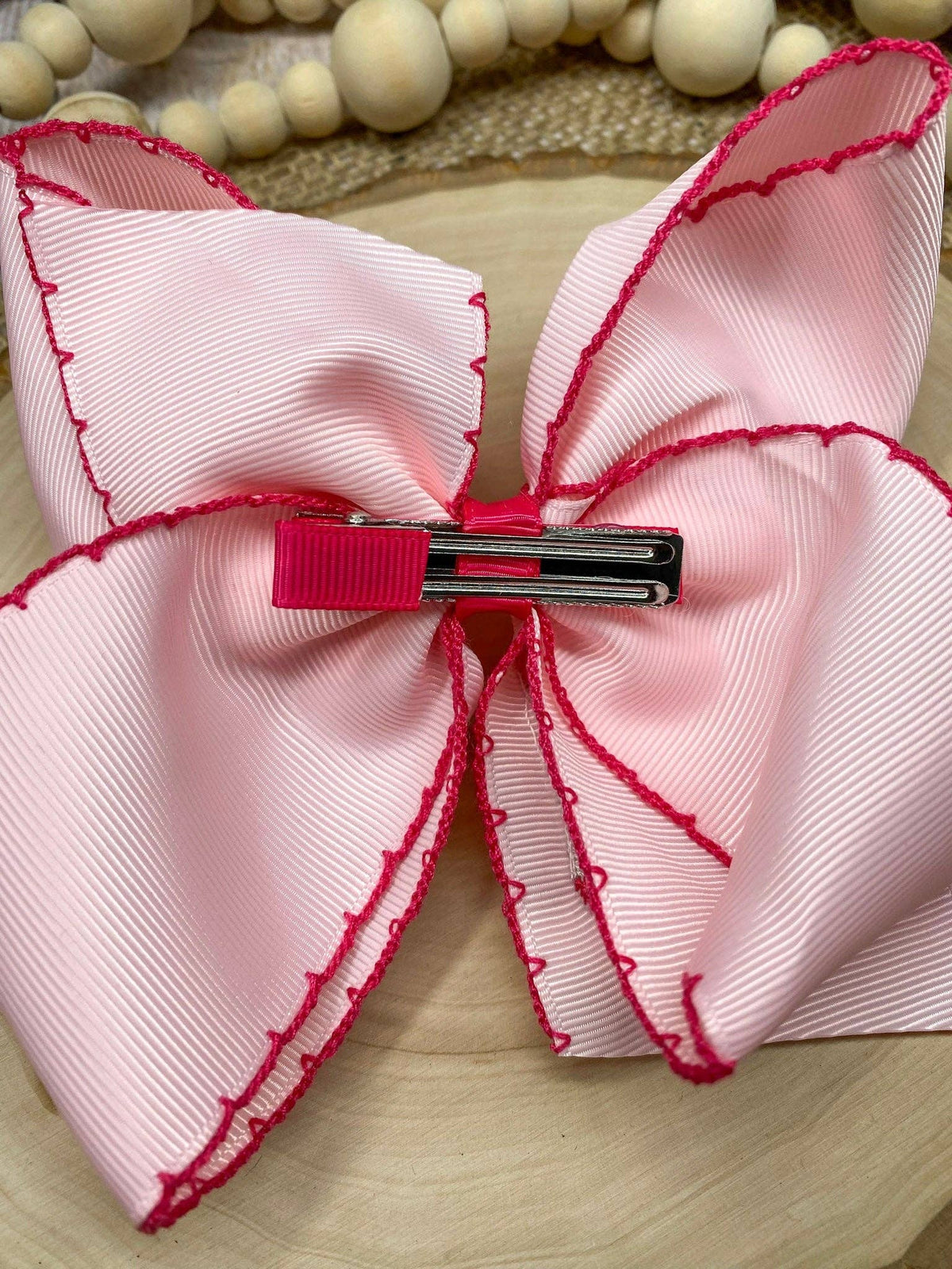 Seaside Custom Apparel & Gifts pink grosgrain hair bow with dark pink moonstitch trim and metal alligator clip