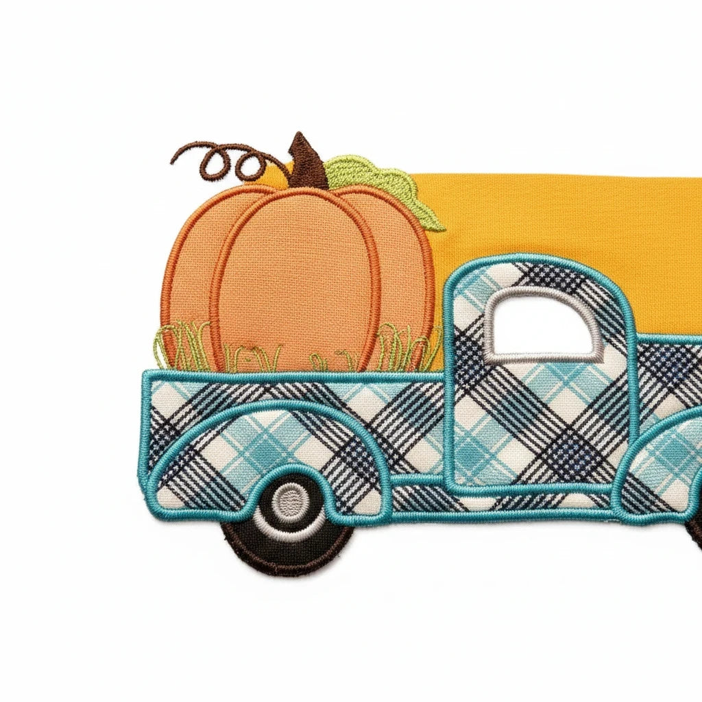 Seaside Custom Apparel & Gifts embroidered patch of a vintage blue plaid truck carrying a pumpkin on yellow fabric