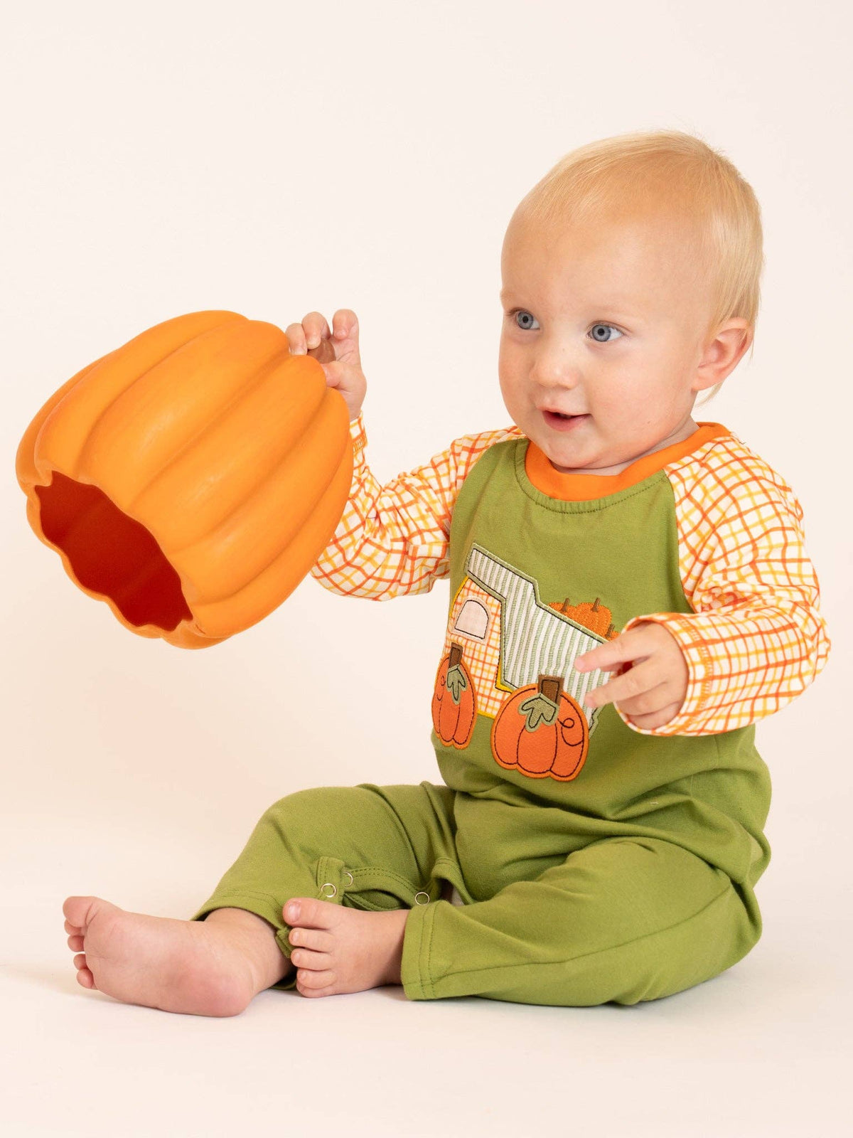 Seaside Custom Apparel & Gifts baby wearing a green and orange plaid pumpkin dump truck embroidered cotton romper