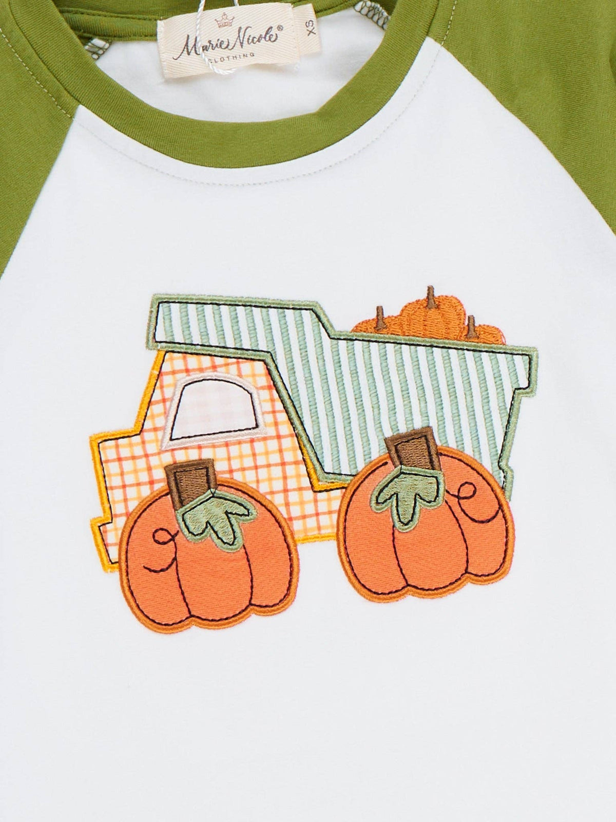 Seaside Custom Apparel & Gifts raglan shirt featuring an embroidered pumpkin truck design on a white and olive top.