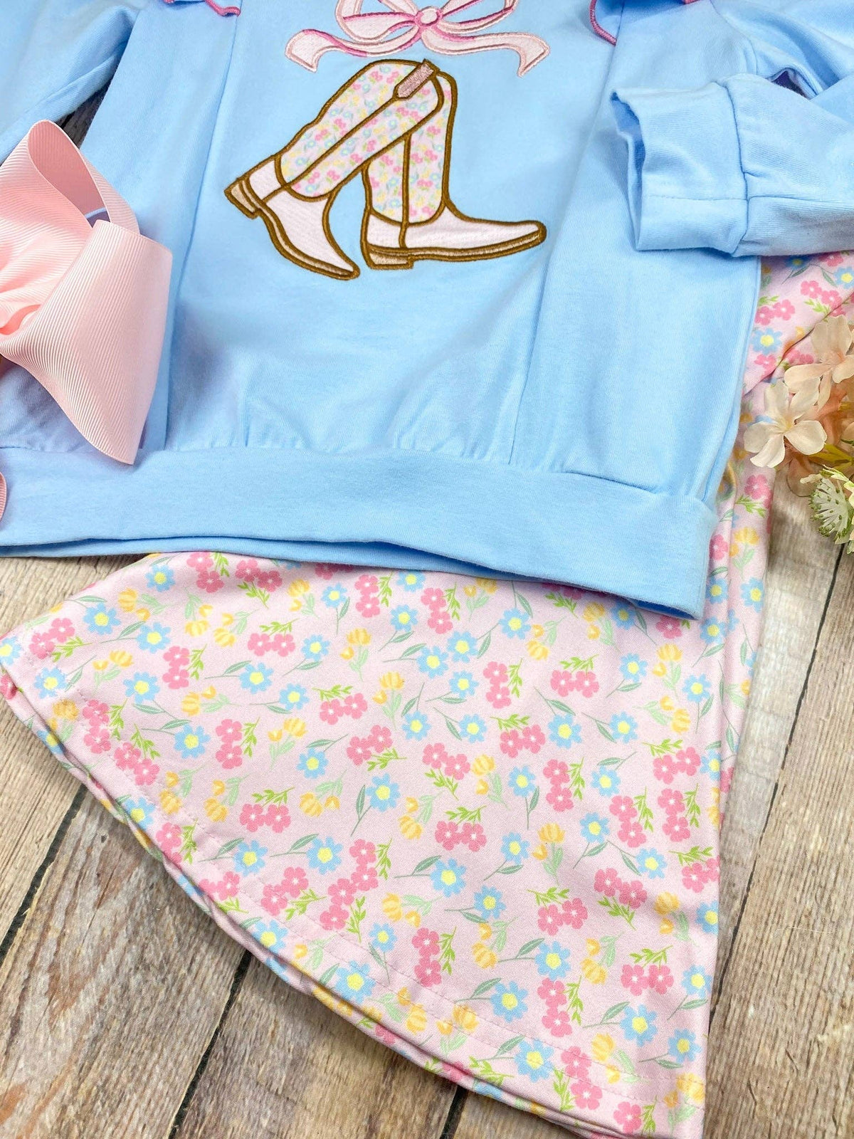 Seaside Custom Apparel & Gifts girls western outfit with blue long sleeve top, cowgirl boot embroidery, and floral pants