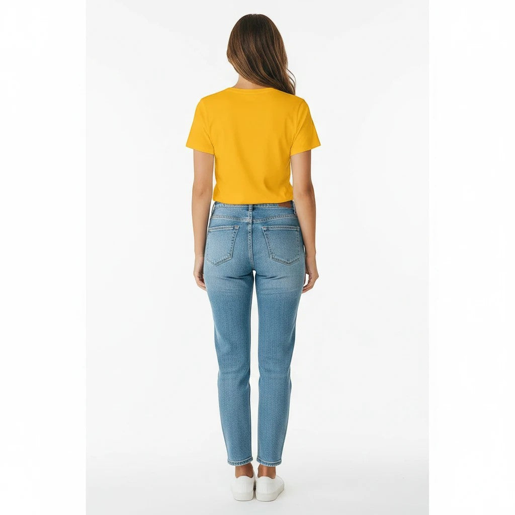 Woman seen from behind wearing a bright yellow Seaside Custom Apparel & Gifts crew neck t-shirt and blue jeans.